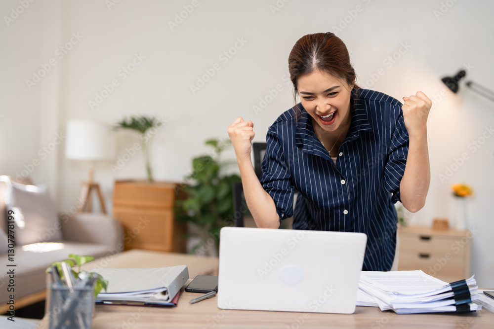 Overjoyed woman looking at laptop screen, celebrating success, showing yes gesture, sitting at work desk, young female excited by good news in email or message, job promotion, money refund. Overjoyed woman looking at laptop screen, celebrating success, showing yes gesture, sitting at work desk, young female excited by good news in email or message, job promotion, money refund.
