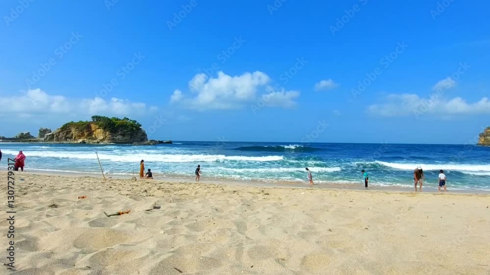 Scenic landscape of a pristine white sand beach with a clear blue ocean and vacationers. Scenic landscape of a pristine white sand beach with a clear blue ocean and vacationers.
