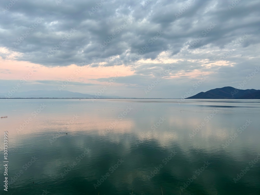 Fototapeta premium reflection on the kerkini lake at sunset