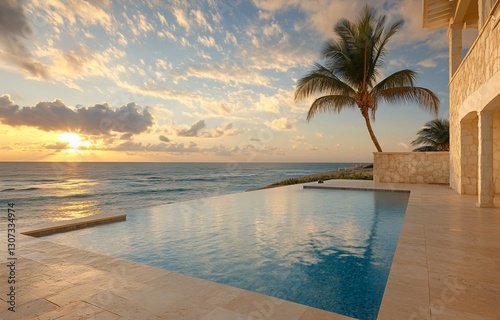 Sunrise over ocean view infinity pool at luxury villa.