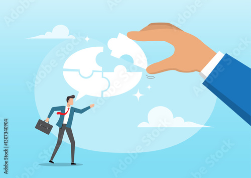 A businessman's hand helps connect jigsaws on a speech bubble