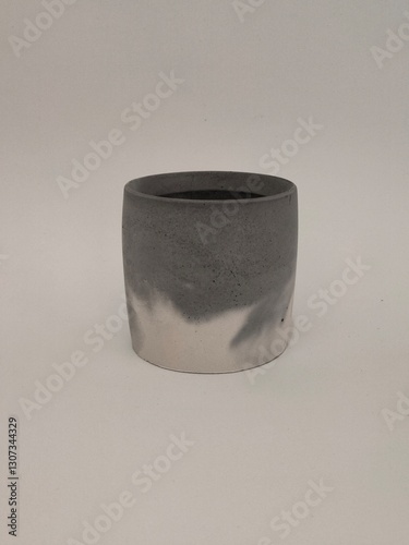 A beautifully handcrafted concrete oval tray with a smooth surface, perfect for organizing essentials in a modern home.