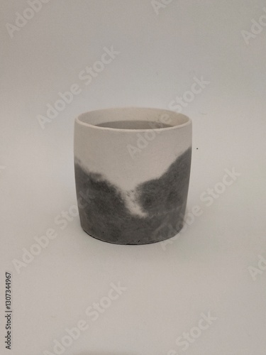 A stylish black and white speckled concrete tray with an artistic touch, perfect for modern home and office decor.