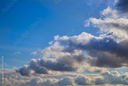 Photography Gray clouds in the sky in a single row, gray clouds in the blue sky signaling a weather change, gray clouds stretching to the horizon as a background