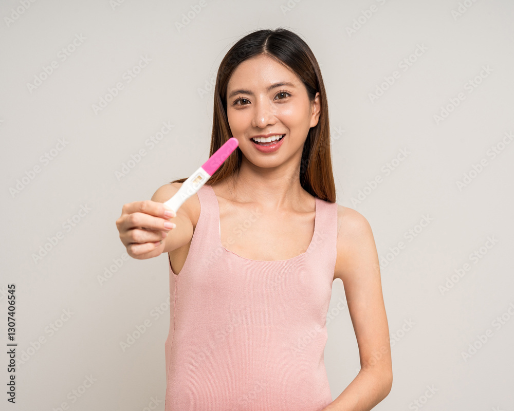 Happy Pregnant asian woman stroking touch belly motherhood with pregnancy test on isolated background. Family planning maternity and pregnancy health. Happy Pregnant asian woman stroking touch belly motherhood with pregnancy test on isolated background. Family planning maternity and pregnancy health.