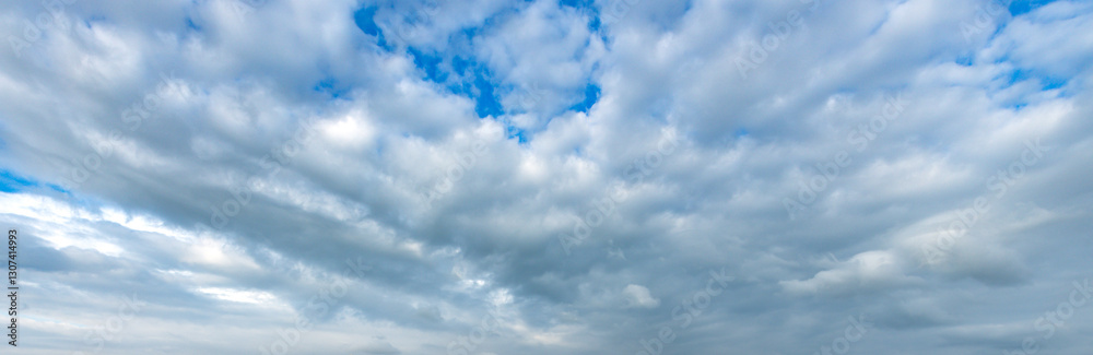 The sky is blue with a few clouds scattered throughout The sky is blue with a few clouds scattered throughout