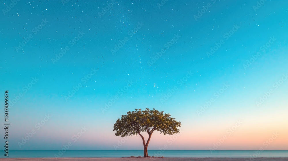 Obraz premium expansive starry night sky with lone silhouette of tree in foreground