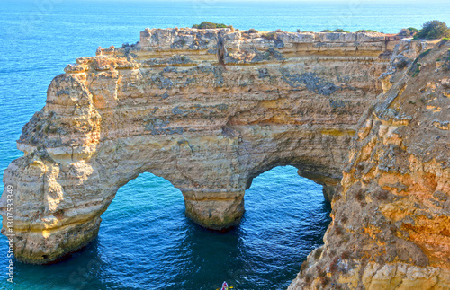 walking path with breathtaking views through the coast from porches to benagil caves lagoa algarve portugal