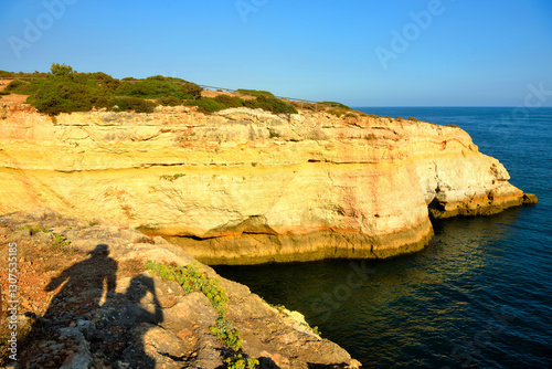 walking path with breathtaking views through the coast from porches to benagil caves lagoa algarve portugal