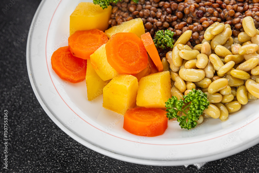 Vegetarian main course vegetables lentils, beans, potatoes, carrots tasty fresh delicious gourmet food background on the table rustic food top view copy space keto and paleo diet vegetarian and vegan Vegetarian main course vegetables lentils, beans, potatoes, carrots tasty fresh delicious gourmet food background on the table rustic food top view copy space keto and paleo diet vegetarian and vegan