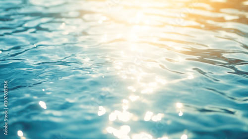 Sunlight reflecting on clear blue water surface with ripples