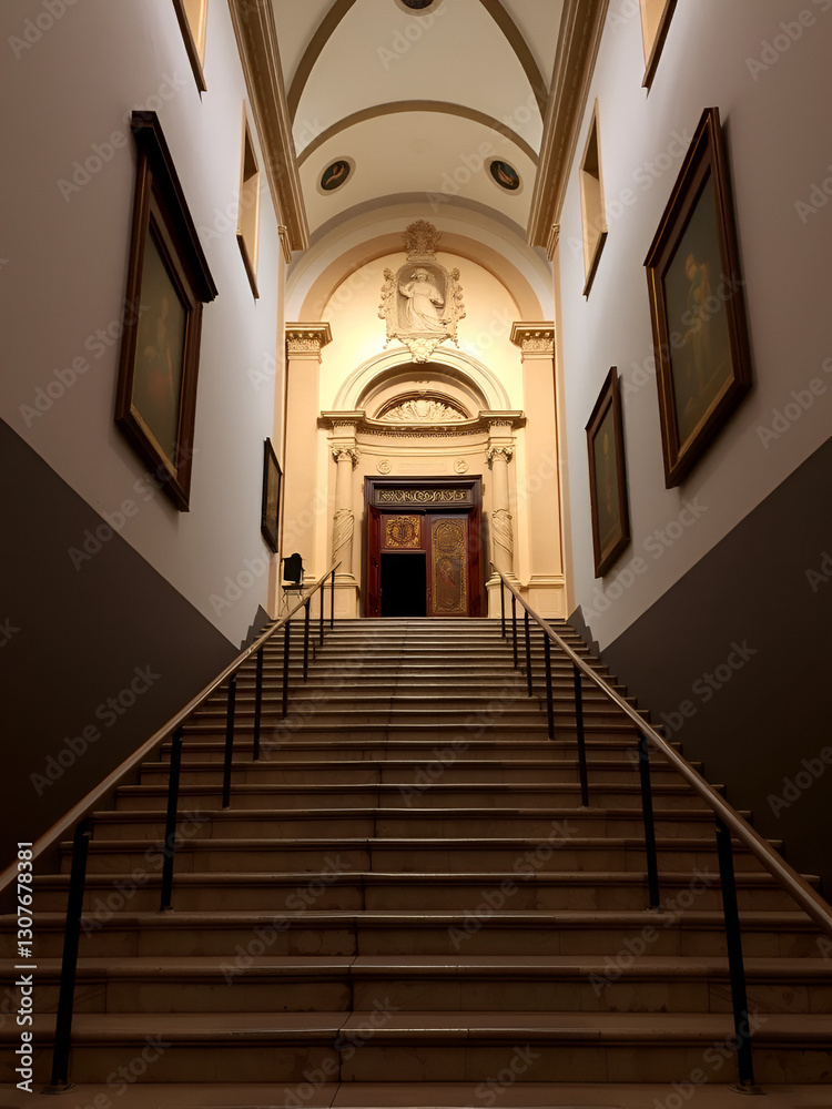 Fototapeta premium Stairs leading us to the main entrance of the parish of Santa Maria Maggiore, Trieste, italy