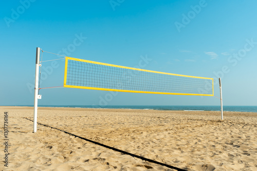 Beach volleyball court with blue summer sky, volleyball net, blue sky, outdoors