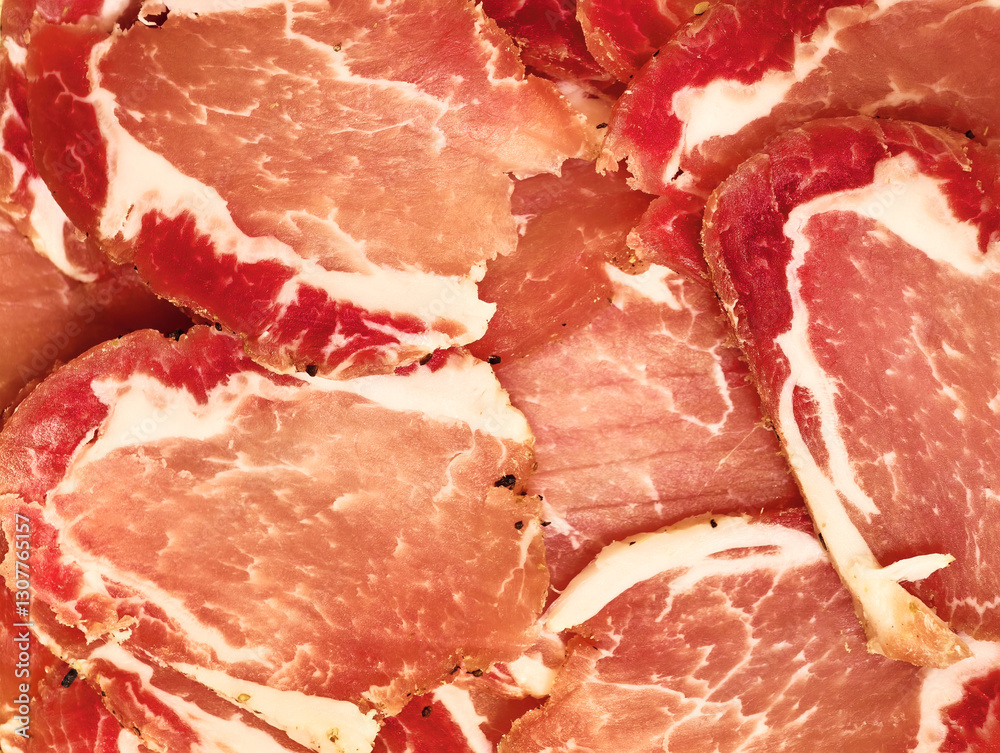 Savory slices of cured meat arranged beautifully for an enticing culinary experience Savory slices of cured meat arranged beautifully for an enticing culinary experience