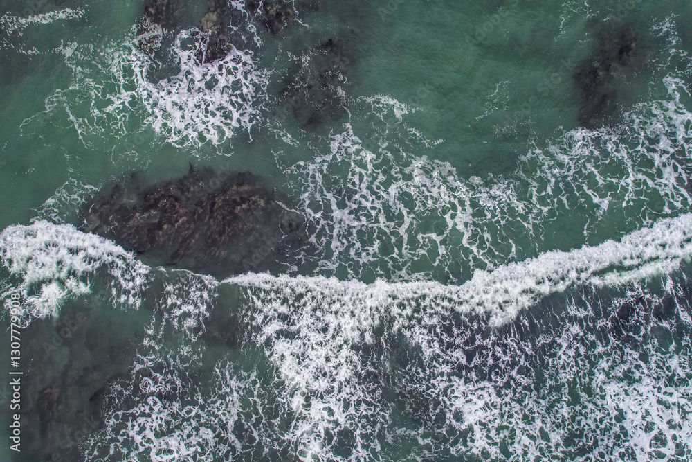 Obraz premium Aerial, Winter’s crashing tidal waves at Down Derry in Cornwall UK