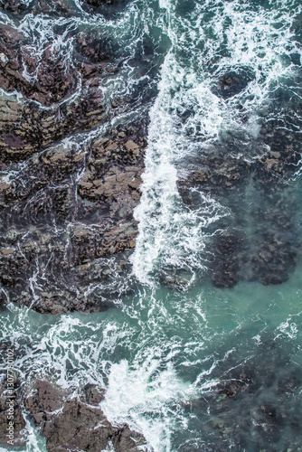 Aerial, Winter’s crashing tidal waves at Down Derry in Cornwall UK