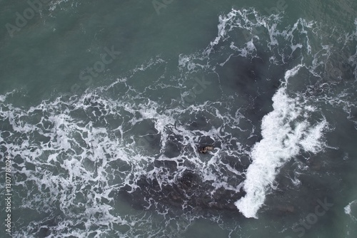 Aerial, Winter’s crashing tidal waves at Down Derry in Cornwall UK