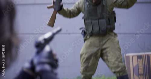 Spy pointing gun at guard who holds his hands and gun in the air as he pees his pants