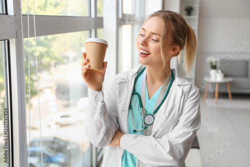 Female doctor with cup of c...