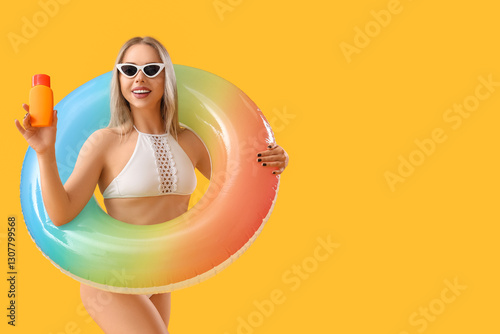 Young woman with sunscreen ...
