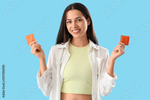 Young woman with condoms on...