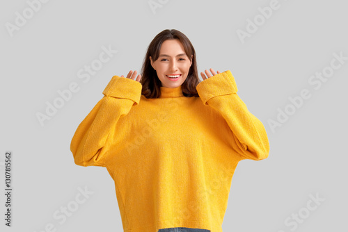 Young woman in yellow sweat...