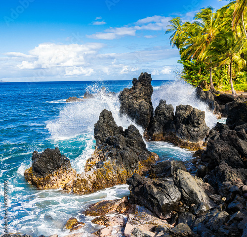 Waves Washing Against The Jagged Lava Spires in Nua' Ailua Bay, Keanae, Maui, Hawaii, USA photo