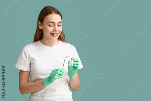 Female dentist with tooth m...