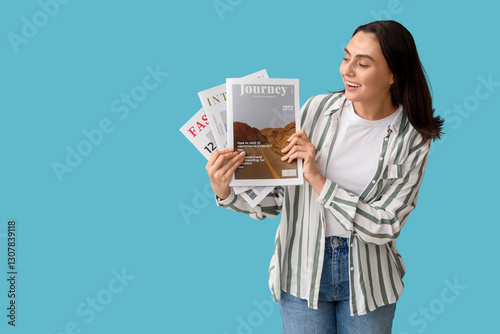 Smiling young woman holding...