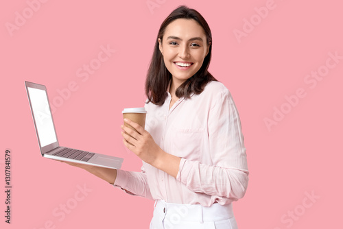 Young businesswoman with la...