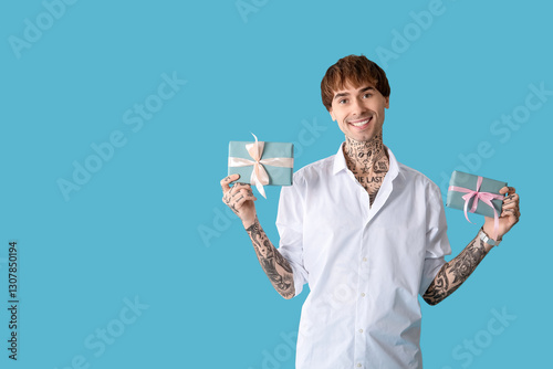 Young tattooed man with gif...