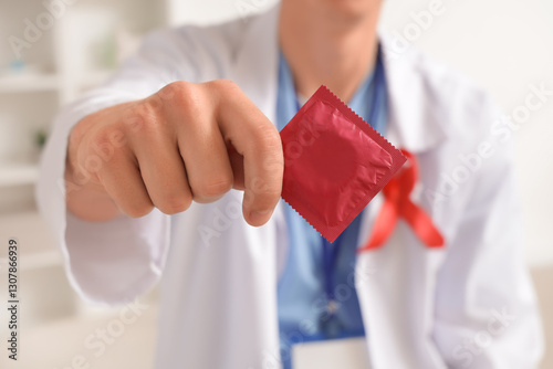 Doctor with red ribbon show...