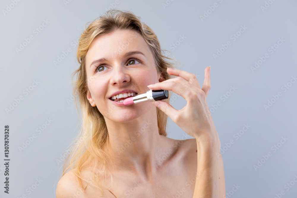 A Beautiful Young Woman Applying Soft Pink Lipstick to Enhance Her Natural Beauty, Radiating Confidence and Joy in a Minimalist Setting A Beautiful Young Woman Applying Soft Pink Lipstick to Enhance Her Natural Beauty, Radiating Confidence and Joy in a Minimalist Setting