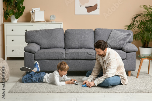 Man and his little son play...