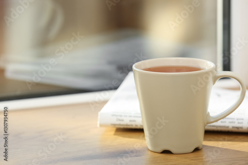 White cup of hot black tea ...