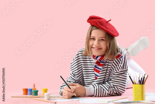 Teenage girl in beret lying...