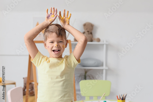 Happy little boy with hands...