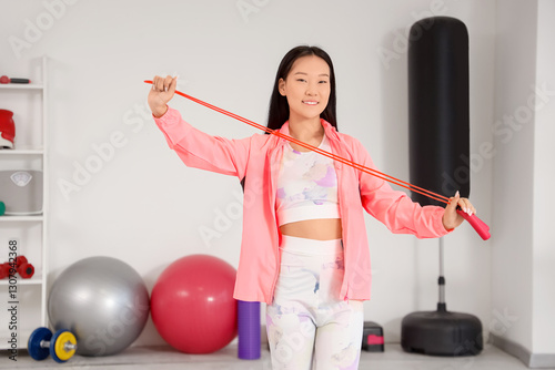 Sporty young Asian woman wi...