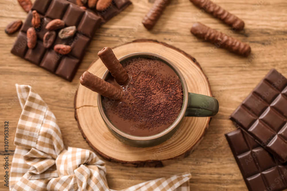Cup of melted chocolate with chocolate sticks on wooden table. Top view Cup of melted chocolate with chocolate sticks on wooden table. Top view
