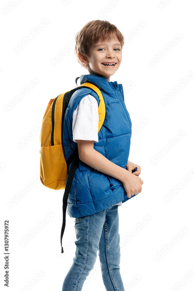 Happy blonde boy sitting on yellow skateboard and holding notebook on white background. Back to School. Happy blonde boy sitting on yellow skateboard and holding notebook on white background. Back to School.