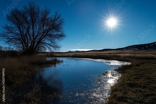 serene blue sky with a glowing sun illuminating the horizon  
 photo