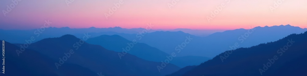 Obraz premium Layered blue mountains meet the horizon under a gradient sky at dusk, soft focus, dusk, mountains