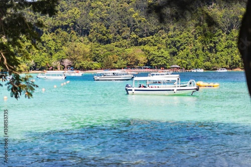 Bild auf Leinwand Tropical Paradise in Sabah – Boats on Crystal Clear Waters, Sapi Island, Kota Ki