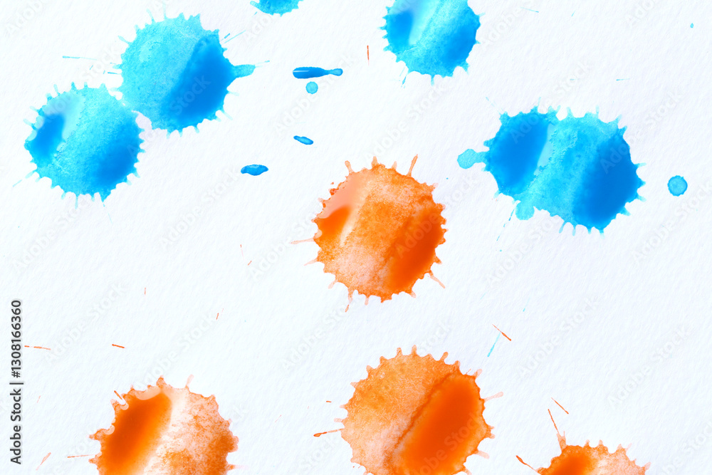 Various color paint drops on paper, causing dispersion of color.