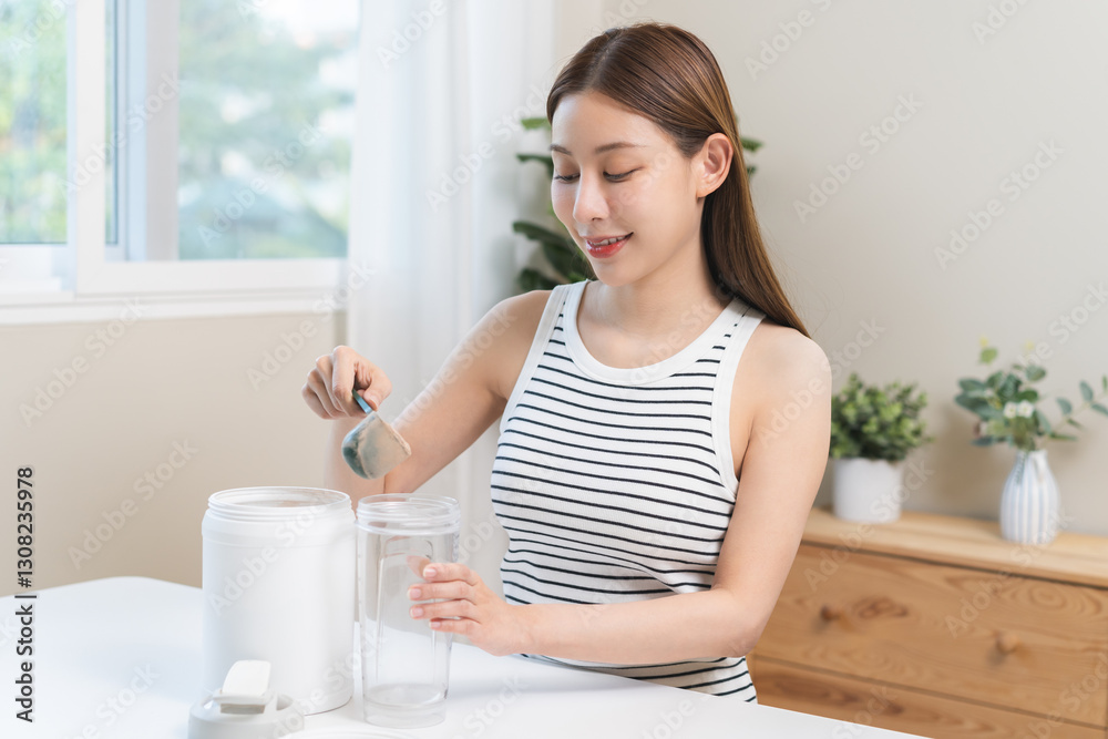 Diet meal replacement for weight loss, asian young woman in sportswear, hand in holding scoop making protein into bottle to shake, drink supplement for muscle after workout at home. Healthy body care. Diet meal replacement for weight loss, asian young woman in sportswear, hand in holding scoop making protein into bottle to shake, drink supplement for muscle after workout at home. Healthy body care.