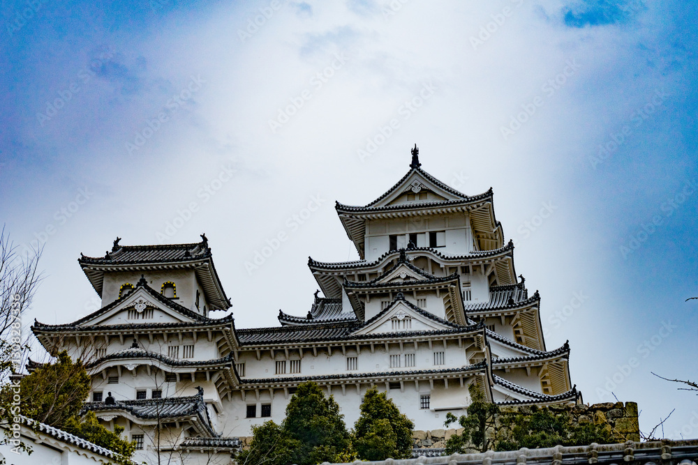 Himeji Castle in Japan under blue sky and white clouds Himeji Castle in Japan under blue sky and white clouds