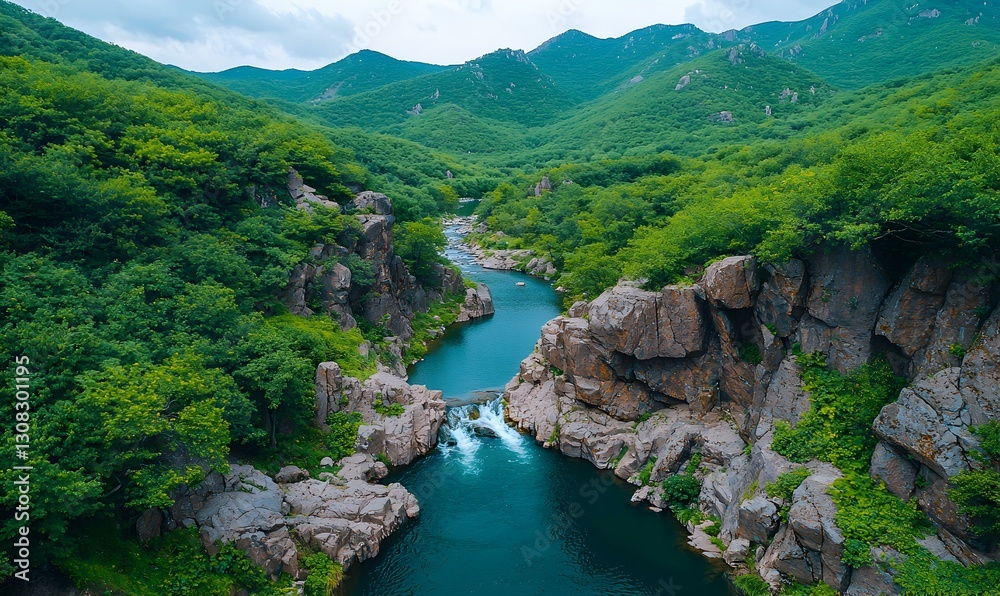 Serene River Flowing Through Lush Green Mountains in Daylight Serene River Flowing Through Lush Green Mountains in Daylight