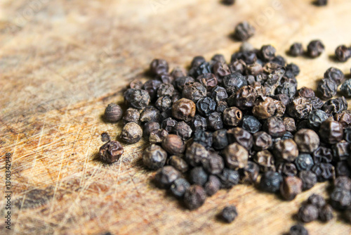 Fototapeta Naklejka Na Ścianę i Meble -  Black peppercorns with wood background. Food ingredients. Aromatic spice