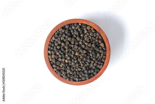 Fototapeta Naklejka Na Ścianę i Meble -  Black peppercorns ( Black pepper ) seeds on wooden bowl isolated on white background. Food ingredients. Aromatic spice. Top view