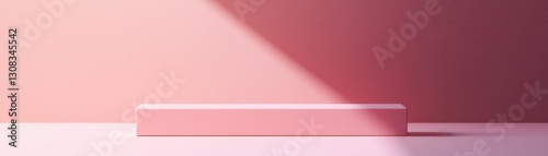 A close-up view of a vibrant pink box resting on a clean white surface, showcasing its smooth texture and subtle sheen, with soft shadows enhancing its three-dimensional form.